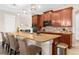 Modern kitchen with barstool seating at the island and custom wood cabinets at 1382 Heritage Landings Dr, Lakeland, FL 33805