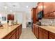 Spacious kitchen with an island, modern appliances, and a stylish countertop at 1382 Heritage Landings Dr, Lakeland, FL 33805