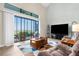 Bright living room with high ceilings and sliding glass doors to a screened patio at 1382 Heritage Landings Dr, Lakeland, FL 33805
