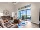 Spacious living room with vaulted ceilings and a large sliding glass door offering serene lake views at 1382 Heritage Landings Dr, Lakeland, FL 33805