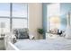 Comfortable bedroom showcasing a large window, decorative chair, and stylish bedside table at 1382 Heritage Landings Dr, Lakeland, FL 33805