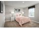 Stylish bedroom featuring a decorative ruffled pink bed set, side tables and contemporary lamps at 1502 Landon Ln, Haines City, FL 33844