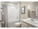 The bathroom has a shower-tub combo, neutral colors, and a single sink vanity at 1538 Landon Ln, Haines City, FL 33844