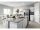 Open kitchen boasts granite countertops, stainless steel appliances, and a view into the dining area at 1538 Landon Ln, Haines City, FL 33844