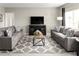 Cozy living room featuring modern decor, comfortable seating, and a contemporary entertainment center at 1538 Landon Ln, Haines City, FL 33844