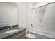 Clean bathroom features a vanity, tub, and shower combination with white tile at 4106 Nw 44 Cir, Ocala, FL 34482