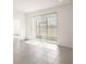 Bright and spacious living room with tile floors and large windows, leading to outdoor views at 4106 Nw 44 Cir, Ocala, FL 34482