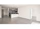 Open living space with tile floors, gray cabinets, and stainless steel appliances in the kitchen at 4106 Nw 44 Cir, Ocala, FL 34482