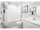 Well-lit bathroom featuring a shower and tub combo, sleek vanity and modern fixtures at 420 Harvard Ct, Dundee, FL 33838