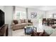 Warm living room adjacent dining area offers a relaxing space for gatherings at 420 Harvard Ct, Dundee, FL 33838