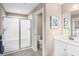 Bathroom featuring a white-tiled shower, toilet, and white sink with countertop space at 480 Crossings Ave, St Cloud, FL 34771