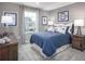 This bedroom features carpet, neutral walls, window, and baseball-themed decor at 480 Crossings Ave, St Cloud, FL 34771