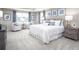 This main bedroom features carpet, neutral walls, and large windows with a view of the neighborhood at 480 Crossings Ave, St Cloud, FL 34771