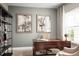 Dedicated home office space with built-in shelving and a large wooden desk at 5739 Anders Way, St Cloud, FL 34771