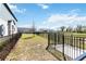 Spacious, fenced backyard with well-maintained grass and a view of neighboring homes at 1126 Desert Candle Dr, Ocoee, FL 34761