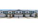 Row of modern townhouses featuring individual garages and neutral color schemes at 1126 Desert Candle Dr, Ocoee, FL 34761