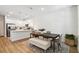 Bright dining area featuring a sleek table and modern furnishings, adjacent to the kitchen for easy entertaining at 3307 Grande Heron Dr, St Cloud, FL 34773