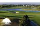 Lush green golf course with water features and blue skies at 3307 Grande Heron Dr, St Cloud, FL 34773