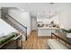 Inviting living space with open layout, connecting the kitchen, dining area, and a staircase leading to the upper floor at 3307 Grande Heron Dr, St Cloud, FL 34773