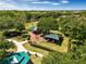 Aerial view of a well-maintained park featuring covered picnic areas, playgrounds, and walkways at 3307 Grande Heron Dr, St Cloud, FL 34773