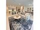Spacious living room offers modern decor, comfortable seating, and an open layout connecting to the kitchen and dining areas at 5240 Luisa Ct, St Cloud, FL 34771