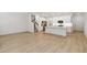 Open-concept layout with hardwood floors, a kitchen, and stairs to the second level at 5240 Luisa Ct, St Cloud, FL 34771