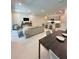 Inviting open-concept living space that integrates the living room, kitchen, and dining area at 5240 Luisa Ct, St Cloud, FL 34771
