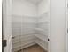 Walk-in pantry featuring wire shelving for optimal storage and organization at 5240 Luisa Ct, St Cloud, FL 34771