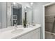 Elegant bathroom featuring double sinks, a modern vanity, and stylish lighting fixtures at 5269 Luisa Ct, St Cloud, FL 34771