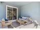 Cozy outdoor patio with comfortable seating, stylish pillows, and a sliding glass door at 5269 Luisa Ct, St Cloud, FL 34771