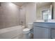 Modern bathroom with a shower, tub, and a stylish vanity with ample storage at 554 Highfalls Ave, Debary, FL 32713