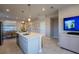 Bright kitchen with an island, dining area, stainless steel appliances, and an open layout at 554 Highfalls Ave, Debary, FL 32713