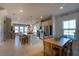 Bright and spacious kitchen with an island, stainless steel appliances, and a dining area at 554 Highfalls Ave, Debary, FL 32713