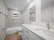 Modern bathroom with double vanity and tub/shower combo with stylish tile at 2404 Needle Palm Dr, Edgewater, FL 32141