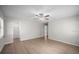 Spacious bedroom featuring a ceiling fan, natural light, and new floors at 2404 Needle Palm Dr, Edgewater, FL 32141