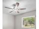 View of bedroom showcasing a ceiling fan and a window with natural light coming in at 2404 Needle Palm Dr, Edgewater, FL 32141