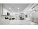Contemporary kitchen with quartz countertops, stainless steel appliances, and white cabinets at 2404 Needle Palm Dr, Edgewater, FL 32141