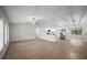 Bright, open-concept living space with modern lighting and new flooring at 2404 Needle Palm Dr, Edgewater, FL 32141