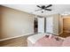 Comfortable bedroom featuring laminate flooring and a ceiling fan at 1161 Cr 443, Lake Panasoffkee, FL 33538
