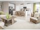 Spacious living area with island seating, stainless appliances and bright natural light at 1548 Covey Rise Ter, Winter Haven, FL 33884
