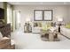 Relaxing living area with a neutral color palette and stylish decorative accents at 1548 Covey Rise Ter, Winter Haven, FL 33884