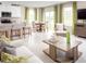 Bright, open living space with kitchen bar, dining area, and modern furniture at 1548 Covey Rise Ter, Winter Haven, FL 33884