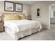 Serene bedroom featuring a plush bed, decorative pillows, and modern artwork at 1548 Covey Rise Ter, Winter Haven, FL 33884