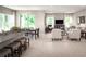 Open concept living and dining area with modern finishes, lots of natural light and a breakfast bar with stool seating at 2193 Aibonito Cir, Clermont, FL 34711