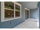 Cozy outdoor balcony with sliding glass doors, offering a serene space to relax and enjoy the view at 5232 Luisa Ct, St Cloud, FL 34771