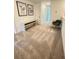 Upstairs hallway features neutral carpet, modern art, and access to bedrooms and bathrooms at 5232 Luisa Ct, St Cloud, FL 34771