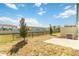 Backyard features patio, fence, small trees, and grass at 1096 Desert Candle Dr, Ocoee, FL 34761