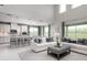 Bright, open living area with large windows and comfortable seating at 136 Venetian Palms Blvd, New Smyrna Beach, FL 32168