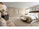 Spacious main bedroom with neutral tones, carpet, and a sitting area at 3210 Tiger Palm Way, New Smyrna Beach, FL 32168