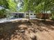 View of spacious backyard including a covered carport and a fenced-in area at 2827 Se 2Nd St, Ocala, FL 34471
